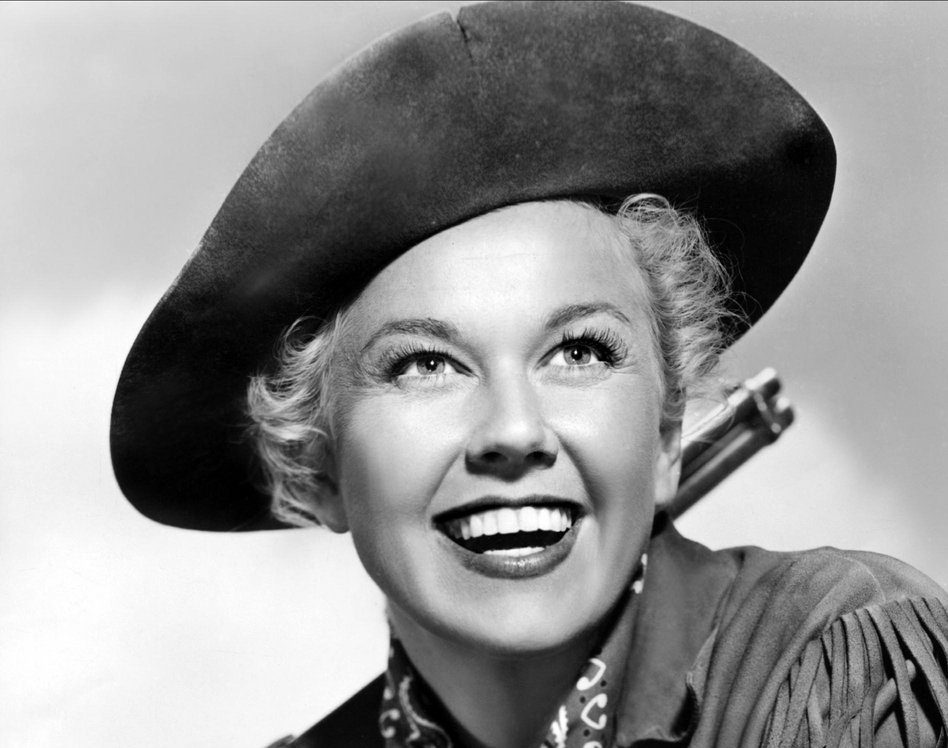 DORIS DAY dressed with a cowboy hat AS CALAMITY JANE, 1953